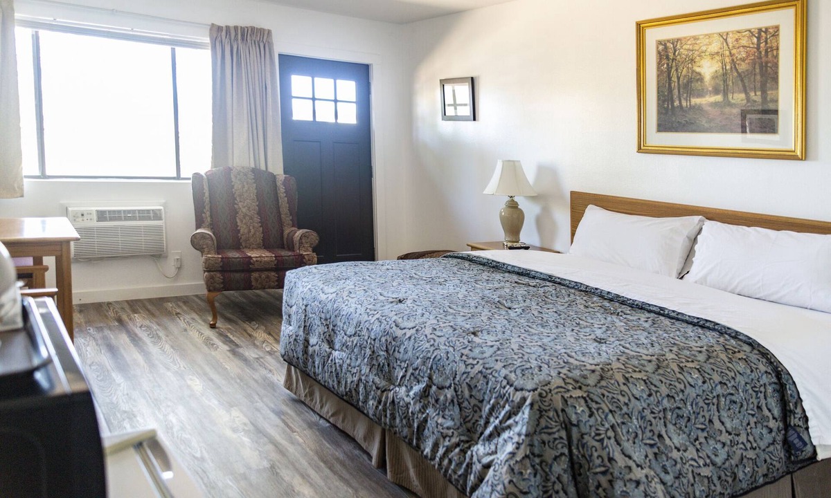 Delta Hotel | Quaint Single King Hotel Room overlooking the Gunnison River and your Private Patio! Perfect for fishing and exploring the outdoors.
