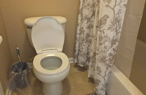 Aurora House | A private bedroom with a private bathroom
