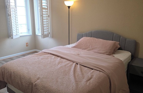 Aurora House | A private bedroom with a private bathroom