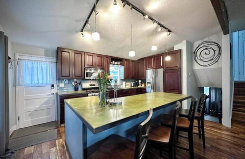 Ruby Hill House | Adventure awaits you in this stylish home with private hot tub spa, on your own enclosed patio. Remodeled home with chef's kitchen, stylish vibe and everything you need. Just minutes to everything Denver has to offer.