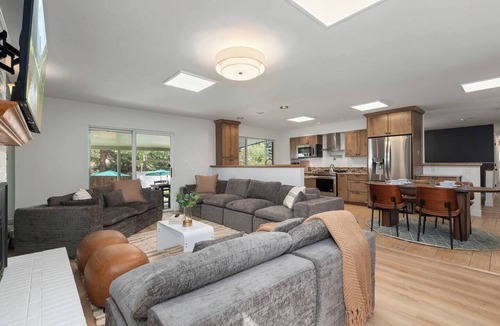 Oak Park House | Arvada Family Retreat with all the amenities: pool, sauna, arcade, and much more