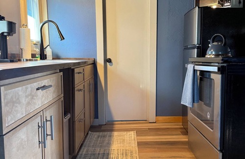 Pine Cabin | Cozy studio cabin in Pine with serene garden and conveniently close to highway.