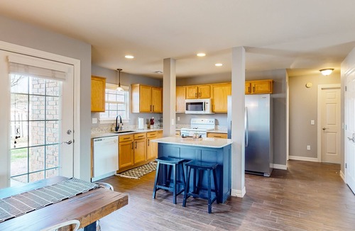 Bentonville House | Dog-friendly charmer with an enclosed yard, fireplace, jetted tub, W/D, and AC
