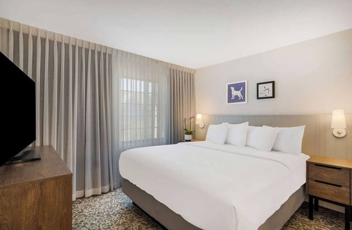 Acres Green Hotel | Home Away From Home - Spacious Suite with Living Space | Outdoor Pool