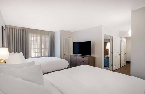 Acres Green Hotel | Home Away From Home - Spacious Suite with Living Space | Outdoor Pool