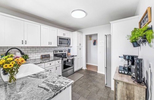 Arvada Plaza Area House | Hot Tub + Games | Epic 6BR Group Home in Arvada