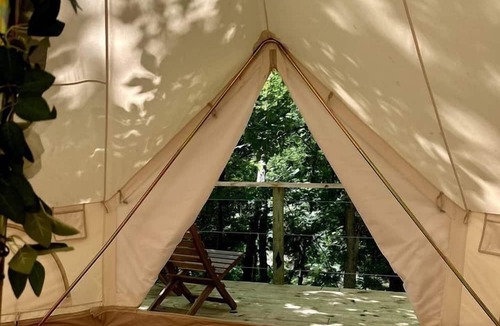 Gentry RV Rental | Peaceful Glamping Tents with Elevated Decks, Cozy Fire Pit, and Secluded Forest Views Near Gentry, AR