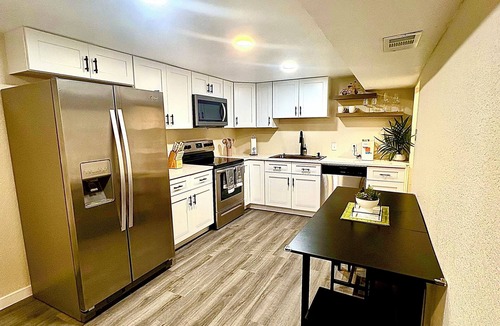 Federal Heights House | Renovated Private Residence Below basement, Garage, EV charger, Fenced patio.