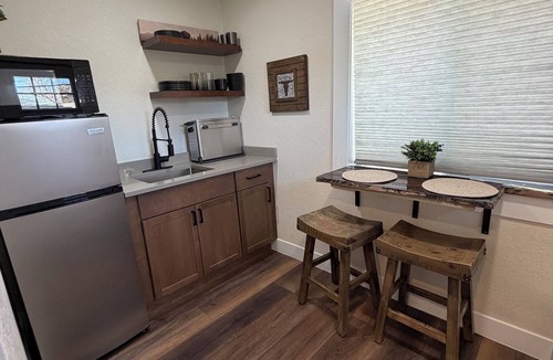 Columbine Apartment | The Cowboy - western inspired them @ the Little Littleton Village