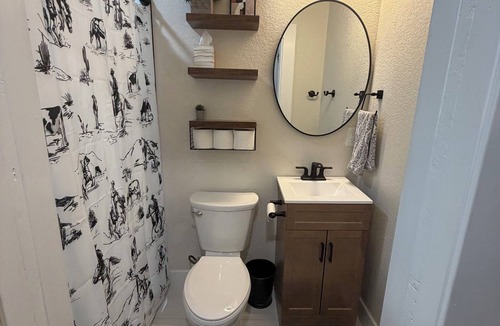 Columbine Apartment | The Cowboy - western inspired them @ the Little Littleton Village