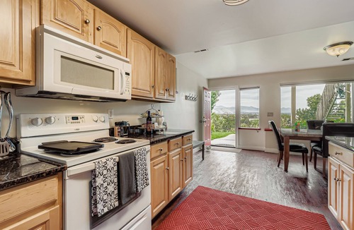 Lakewood Ski Chalet | This is a serene space. Open landscape of a lush garden, mountains, and beyond!