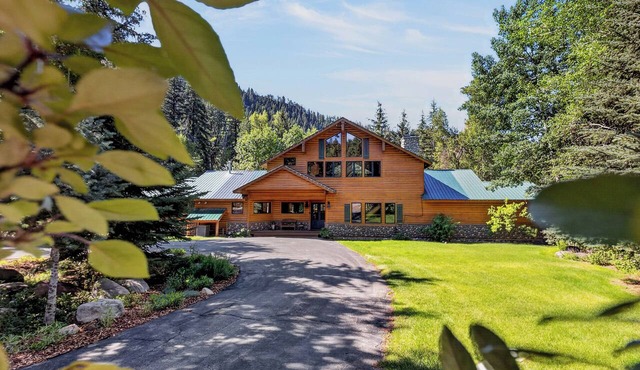Beautiful Colorado log home backing to the Florida River.