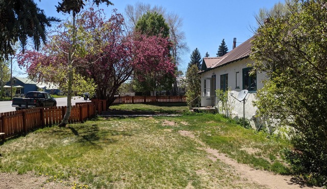 Cheerful 3 bedroom in convenient location with a hot tub, sunroom and big yard.