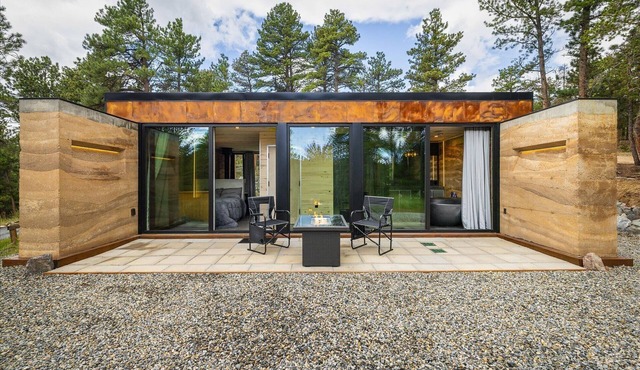 Earth-Built Cabin with Pine Shadows and a Tub That Waits