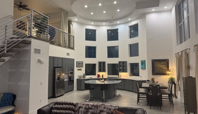 Incredible 2 level loft with 30ft ceilings -expansive balcony with STRIP VIEWS!