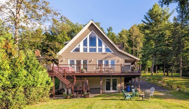 Luxury Lake House: Private Beach, Hot Tub, Firepit, A/C, Grill, Deck, more! in Broadalbin