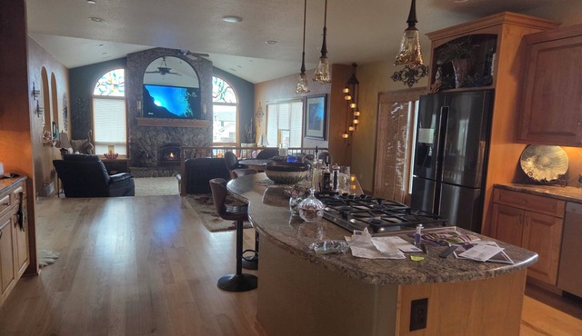 Oversized three car garage, huge barn, beautiful pond, grill on upper deck.