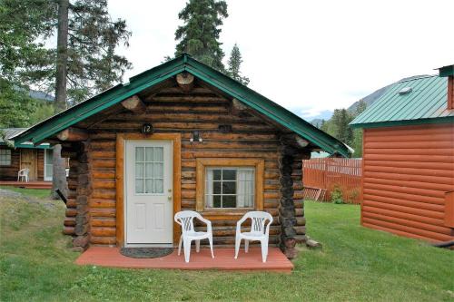 Traditional Log Cabin with Large Windows on the Kenai Peninsula, Alaska in Cooper Landing